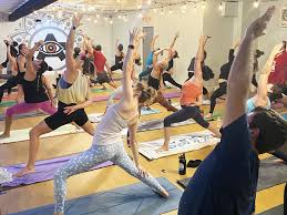 Picture of people doing yoga at Arrichion Yoga Studio