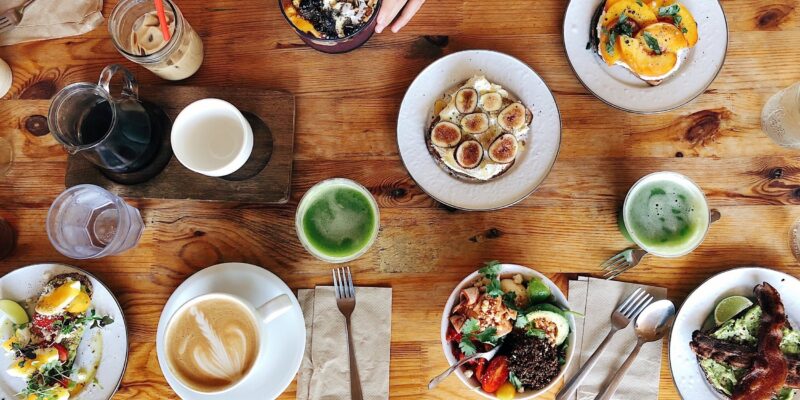 A spread of food and drinks on a table from Sola Coffee